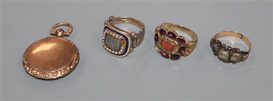 Three assorted 19th century rings including mourning ring (a.f.) and a similar yellow metal locket.